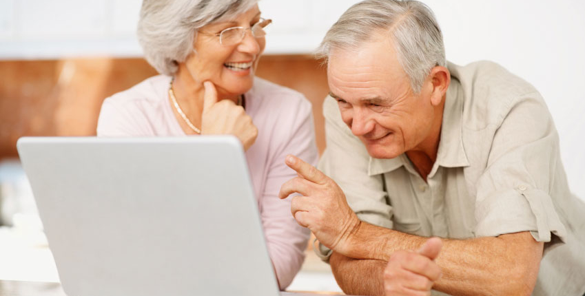 seniors on computer from reverse mortgages canada